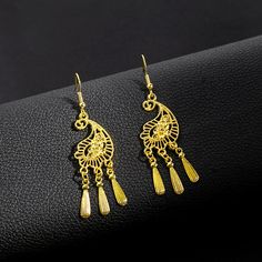 Material: Alloy Style: Ethnic Style Elegant Tassel Earrings For Festival, Elegant Tassel Chandelier Earrings For Festivals, Elegant Festival Chandelier Earrings With Tassels, Elegant Dangle Tassel Earrings For Festivals, Gold Dangle Earrings With Peacock Design, Traditional Gold Tassel Festival Earrings, Traditional Gold Tassel Earrings For Festivals, Bohemian Gold Chandelier Earrings With Tassels, Peacock Design Dangle Chandelier Earrings