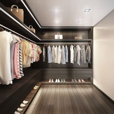 a walk in closet filled with lots of clothes