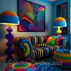 a living room filled with colorful furniture next to two lamps on either side of the couch