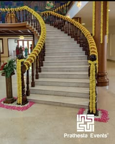 the stairs are decorated with yellow and pink flowers