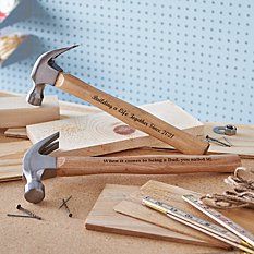 a hammer and some woodworking tools on a table