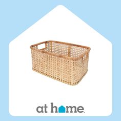 a brown basket sitting on top of a blue and white background with the words at home above it