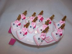 there are many small cakes with bows on the plate, and one is made out of plastic