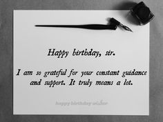 a piece of paper with a fountain pen on it next to a happy birthday card