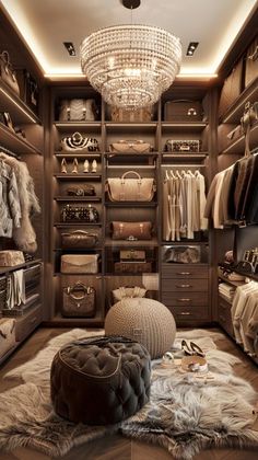 a walk in closet filled with lots of clothes and bags on top of a rug