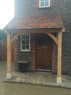 a small brick building with a wooden door