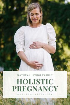 a pregnant woman holding her stomach with the words, natural living family holstic pregancy