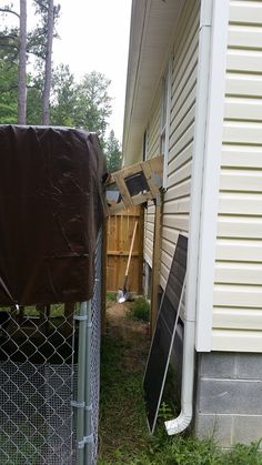 the back yard is fenced off and there are some trash bags on the ground