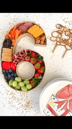 a birthday cake with fruit and crackers in the shape of a number 5 on it