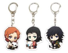 three key chains with anime characters on them