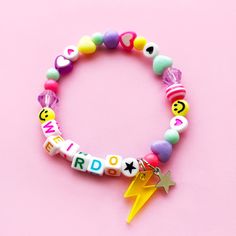 A super cute mix of quality acrylic pastel beads  in all the candy colours, complete with a neon acrylic lightning bolt charm and stainless steel star charm. Can be personalised with any name or word. Available in 4 different sizes. Personalized Pink Charm Bracelet, Customized Trendy Pink Charm Bracelet, Playful Letter Beads Charm Bracelet For Birthday, Playful Charm Bracelet With Letter Beads For Birthday, Playful Multicolor Personalized Charm Bracelet, Playful Customized Name Bracelet, Trendy Name Bracelet For Birthday, Trendy Pink Charm Bracelet With Letter Beads, Funky Pink Jewelry For Birthday