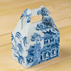 a blue and white box sitting on top of a wooden table