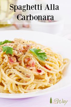 spaghetti alla carbonara on a white plate with parsley