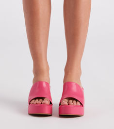 Give off fabulous vibes in these of-the-moment platform mules! They feature an open almond-shaped toe. a wide banded toe strap. an open back for easy on-and-off styling. a platform sole. and a thick block heel. Pair with a quilted handbag.Fit & Features Open almond-shaped toe Wide banded toe strap Open back Platform sole Thick block heel Faux leather material. subtle cushioned insole Runs true to size Bold Platform Sandals For Spring, Trendy Summer Clogs For Party, Spring Open Toe Platform Slippers With Heel Loop, Bold Spring Platform Sandals, Trendy Summer Party Clogs, Spring Platform Slide Mules, Spring Mules With Chunky Platform And Wedge Heel, Trendy Summer Platform Slippers With Heel Loop, Chic High Heel Platform Slippers With Heel Loop