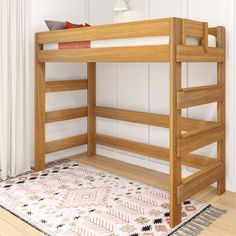 a wooden bunk bed sitting on top of a rug in front of a white wall