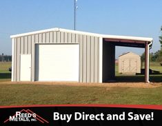 two garages in the middle of a field with an american flag flying above them