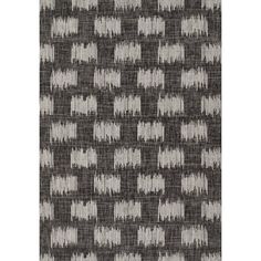 a black and white rug with an abstract pattern on the bottom, it is shown