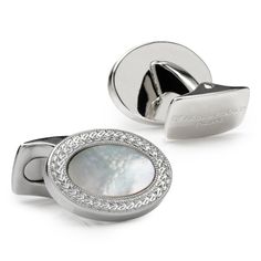 Take a classic oval design and add a stunning inlay of hand-cut mother of pearl to create a timeless pair of cufflinks.Originally designed by Francis Deakin in the 1920s, these white rhodium cufflinks have been bought back to life with an intricate wreath pattern and delicate millgrain edge. Traditionally worn with white tie, the bright, clean style would be perfect for any daytime attire.Part of the Fundamentals collection, this innovative range offers the highest quality cufflinks that are mad Back To Life, The 1920s, White Tie, Base Metal, Classic White, Rhodium Plated, Mother Of Pearl, Cufflinks, Take That