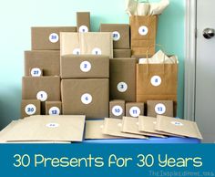 there are many boxes and bags on the table with numbers in them that read 30 presents for 30 years