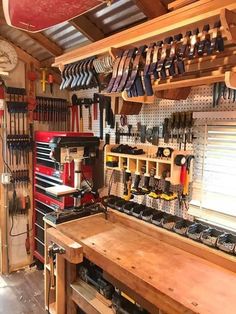 a workbench filled with tools in a garage