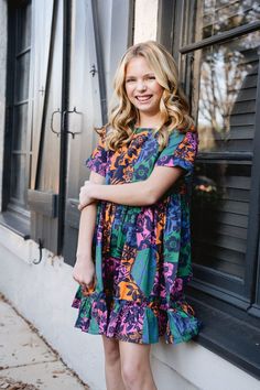 Back-to-school fashion just got a lot more fun with our Ollie Floral Colorblock Dress! This dress features a playful color combination and a flirty ruffle hem, perfect for standing out in class and beyond. Machine washable, hang to dry 100% Cotton Style #3006 Playful Multicolor Short Sleeve Twirl Dress, Playful Multicolor Color Block T-shirt, Multicolor Vibrant Print Knee-length Mini Dress, Multicolor Floral Print Knee-length Mini Dress, Back To School Fashion, Multicolor Floral Print A-line Mini Dress, Maxi Skirt Dress, Matches Fashion, Colorblock Dress