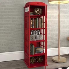 a red bookcase with many books on it