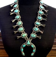 GLORIOUS OLD SQUASH BLOSSOM NECKLACE DESCRIPTION:  Breathtaking specimens of natural turquoise along with handmade Navajo pearls with filed edges. This necklace will be a valuable addition to your collection of the very finest vintage Southwestern and Native American jewelry. MEASUREMENTS:  Necklace measures 26" end to end Naja measures 2 7/8" x 2 5/8" Beads are securely strung on silver foxtail chain WEIGHT:  294.2 grams SIGNED: no STERLING:  unmarked, verified sterling silver Jewelry Measurements, Turquoise Squash Blossom, Navajo Pearls, Squash Blossom Necklace, Squash Blossom, Wedding Jewellery Necklace, Denver Co, American Jewelry, Natural Turquoise