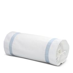 a rolled up white and blue blanket on a white background