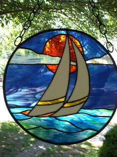 a stained glass window with a sailboat on it