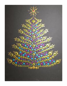 a colorful christmas tree made out of beads on a black background with yellow and blue dots