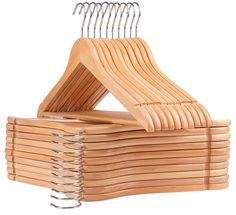 several wooden hangers stacked on top of each other