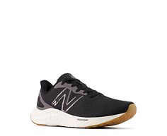 the new balance running shoe in black and white