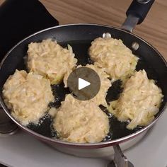 a frying pan filled with food on top of a stove