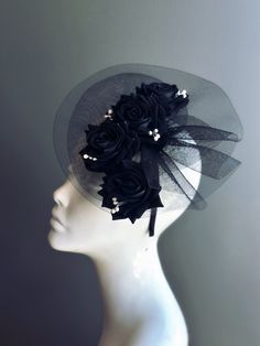 This all-black headpiece features elegant black roses set against a fine black mesh. Perfect for adding a touch of sophistication to any special occasion Age Group/Gender - Adult/Women Size/Type - One size fits all adults Color - black Special Features - Black roses and white buds