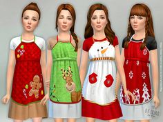 three girls wearing christmas themed aprons standing next to each other