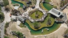 an aerial view of a park with lots of water