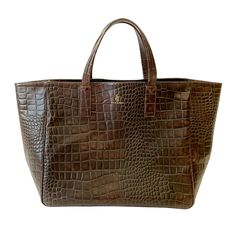 The Faux-Coco "croc-effect" Weekender is handcrafted in California of rich, 100% Italian, vegetable tanned cow leather debossed with an exquisite Nile Croc pattern. The roomy, luxurious, natural suede leather interior allows for great versatility in its use. Inspired by our insatiable appetite for exploration and travel, this bag is the ultimate in our series of #weekenderbags perfect for your next getaway. #stickandball #leathertote #bag #earthtones Equestrian Chic, Leather Weekender, Weekender Bag, Leather Interior, Signature Style, Italian Leather, Cow Leather, Leather Tote, Suede Leather