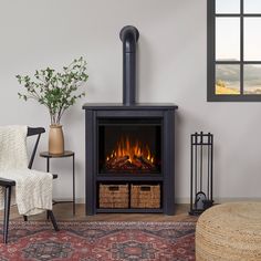 a living room with a fire place in the center and a chair next to it