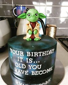 a star wars themed birthday cake with an image of yoda from the child's movie