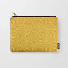 a yellow and white pattern with circles on it carry - all pouch, featuring zipper closure