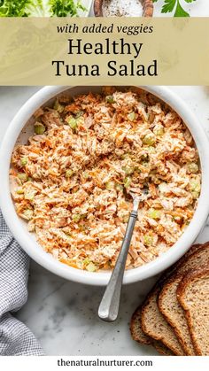 healthy tuna salad in a white bowl with bread on the side and text overlay