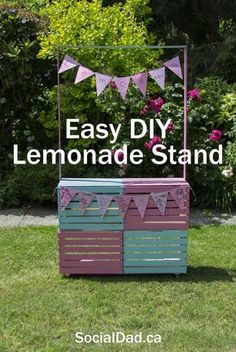 an easy diy lemonade stand made out of pallet wood and painted in pink, blue and green