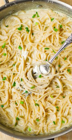 a large pot filled with pasta and peas