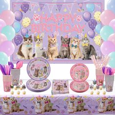 a birthday party with cats sitting on the table and balloons in the air behind it