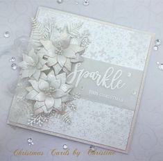 a white christmas card with snowflakes on it and the words sparkle this christmas