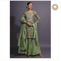 Moss Green Sharara Suit In Cotton With Floral Print. Accentuated With Beautiful Gotta Patti Work On The Border And Yoke. Crafted With Round Neckline 3/4th Sleeves. The Sharara And Dupatta Are Enhanced With Gotta Lace Embroidered Checks. Slight Variation In Color Is Possible Due To Digital Photography. Size- 4 (Us) Color: Green Fabric: Cotton Work: Gotta Patti, Print Closure: Side Zip Neck Line: Round Sleeves: 3/4th Sleeve New White Indian Outfit, Pink Sharara Suit, Green Sharara Suit, Indian Dresses Anarkali, Green Sharara, Pink Sharara, Gotta Patti Work, Peach Jacket, Salwar Kameez Online Shopping