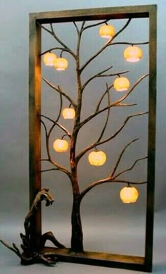 a lighted tree with lanterns in it