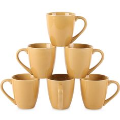 a stack of yellow coffee cups sitting on top of each other