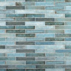 a close up view of a tile wall with blue and gray colors on it's sides