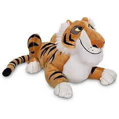 a stuffed tiger laying on the ground with its eyes wide open and one eye closed